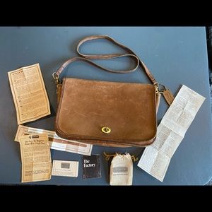 Vintage tan leather coach bag with paperwork. Brass hardware Surface scratches